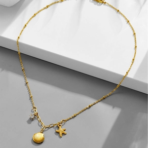 18k gold plated stainless steel necklace featuring starfish, shell, and zircon pendants