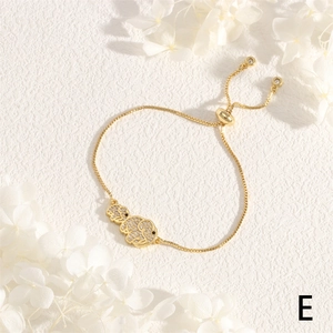 Detail of gold elephant charm bracelet with sparkling zircons and adjustable box chain