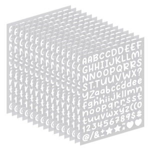 Detailed stack of small white alphabet and number stickers for scrapbooking and DIY decor