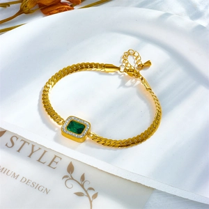 Golden bracelet featuring a rectangular emerald zircon with a flat Cuban chain link