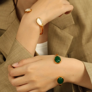 Retro 18k gold plated stainless steel open cuff bracelet with oval cat eye stone accents
