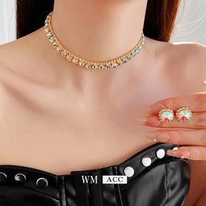 Double-layered gold necklace and stud earrings set with AB rainbow crystals on model