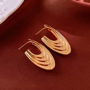 Elegant gold-tone multi-layer U-shaped drop earrings with a polished metallic finish
