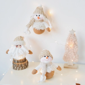 Christmas plush ornaments featuring snowman and santa in warm white and brown tones