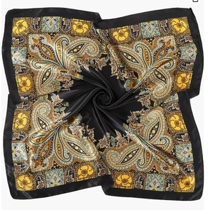 Detail of black satin square scarf with golden paisley pattern and silky texture