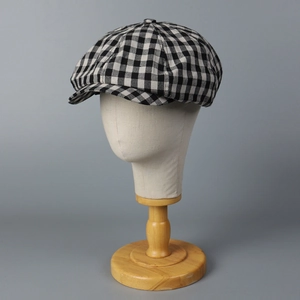 Classic black and white checkered newsboy hat in retro linen style for men and women