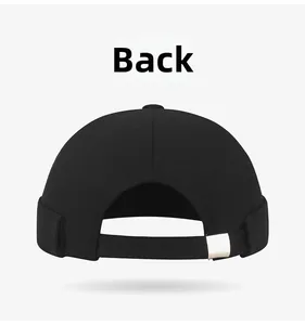 Back view of black brimless Docker cap with adjustable strap and silver metal buckle