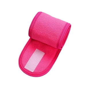 Detail of rose pink microfiber spa headband showing wide velcro closure and soft texture