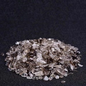 Macro shot of smoky crystal chips on a black textured surface for home decor