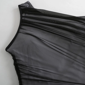 Detail of black mesh swimsuit featuring semi-transparent texture and pleated design