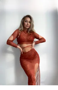 Close-up of marble print mesh long sleeve crop top and high slit skirt two-piece set