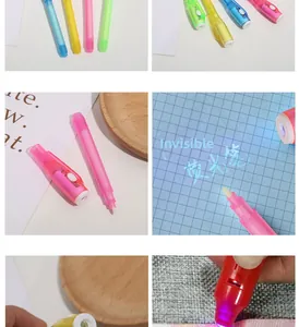 Detail of four colorful UV invisible ink pens showing the built-in LED light and writing effect