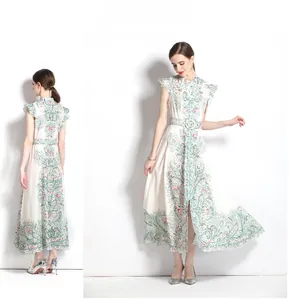 Detail of vintage floral maxi dress with ruffle sleeves and matching waist belt