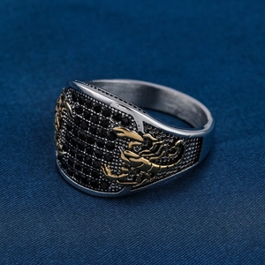 Retro stainless steel ring with black zircon pavé and golden scorpion embossment