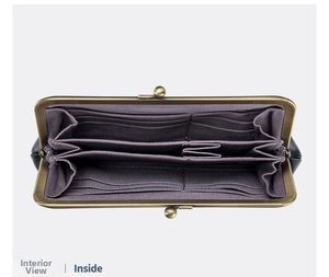 Macro view of vintage leather purse interior with multiple card slots and bronze clasp