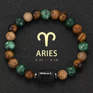 Close-up of Aries zodiac bracelet with natural tiger eye and green stone beads