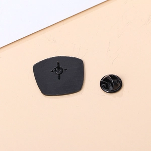 Outdoor camping badge back view with black metal alloy pin and butterfly clutch fastener