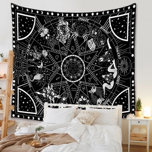 Detail of bohemian tapestry featuring zodiac signs and astrological symbols on bedroom wall