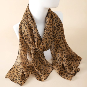 Close-up of leopard print chiffon scarf with elegant brown spots and soft texture