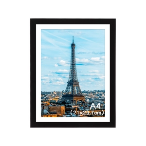 Detailed view of black A4 PVC photo frame with white mat and Eiffel Tower art print