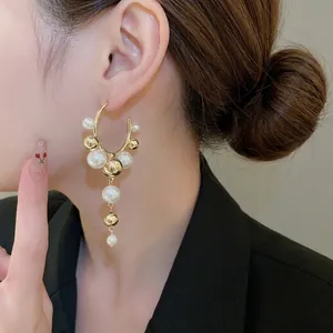 Elegant C-shaped pearl tassel earrings with gold-plated geometric charms for women