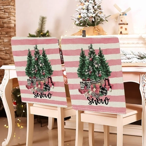 Detail view of pink striped Christmas chair covers with festive tree and snow text