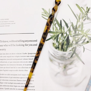 Minimalist acetate hair stick with tortoiseshell pattern and twisted spiral design