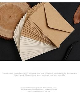 Macro detail of kraft paper envelopes with V-flap design in vintage stationery setting