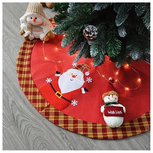 Detail of Christmas tree skirt featuring 3D Santa and Snowman applique on felt fabric