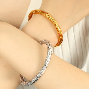 Minimalist vintage style open cuff bracelets with hammered texture in gold and silver