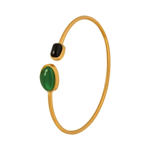 Golden open bangle bracelet with green oval and black rectangular gemstones in retro style