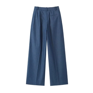 Rear view of deep blue wide-leg trousers showing waist pockets and professional tailoring