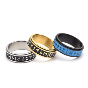 Luminous spinning Viking rune rings in silver, gold, and black blue titanium steel