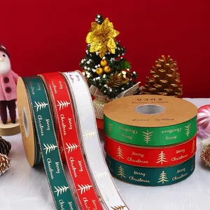 Christmas gift ribbons in red and green with golden Merry Christmas text and tree patterns