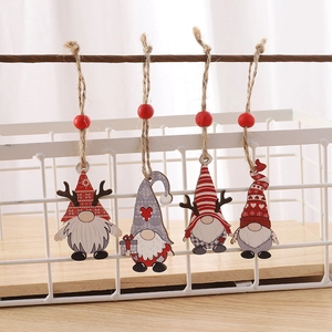 Close-up of wooden Christmas gnome pendants with red beads and natural jute ropes