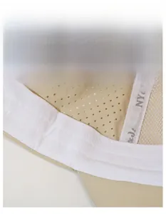 Detail of breathable mesh fabric and wide moisture-wicking sweatband inside the baseball cap