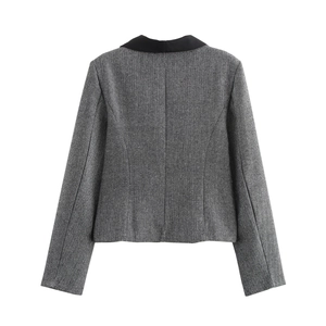 Back view of a gray herringbone blazer featuring a contrasting black lapel collar