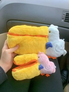 Creative pelican plush storage bags in two sizes held in a car interior setting
