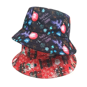 Christmas bucket hats with Santa, snowman and snowflake prints on black and red plaid fabric