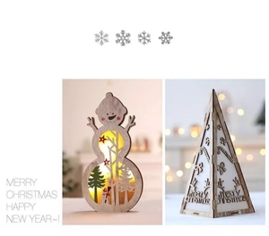 Detail of wooden LED Christmas decorations featuring snowman and tree shapes with warm lights