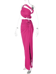 Detail view of the rose red crop top and side slit skirt set with stretch fabric texture