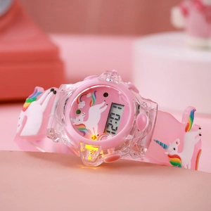 Detail of pink unicorn kids watch with luminous digital display and silicone strap