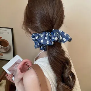 French vintage style dark blue floral denim scrunchie with pleated design for ponytail
