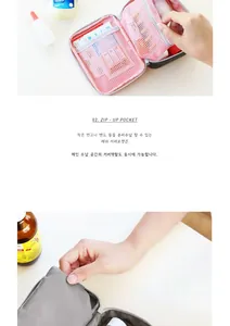 Detailed view of the internal pink mesh zip pocket storing medicines and first aid supplies