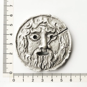 Detailed view of Mouth of Truth resin fridge magnet with 6cm diameter measurement