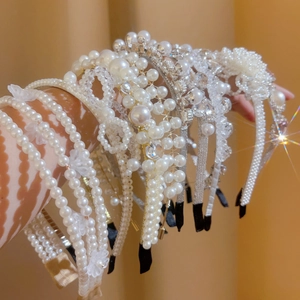 French vintage pearl headband set with crystal floral designs for an elegant bridal look