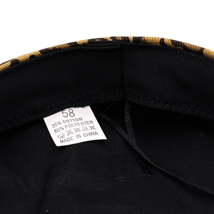 Inside view of leopard print cotton baker boy hat showing size label and fabric lining