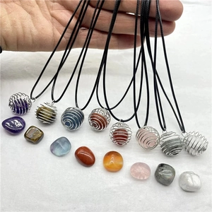 Natural crystal stone necklaces in silver spiral cage pendants with black cord straps