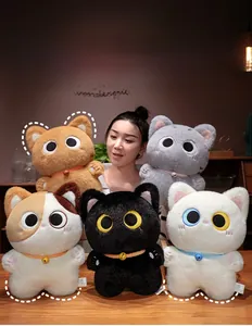 Close-up of plush cat toys collection featuring colorful kittens with golden bells