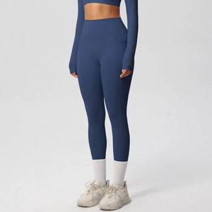 Detail view of high waist navy yoga leggings with side pockets and matching crop top
